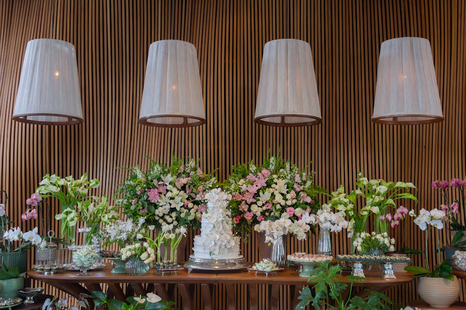 Luxurious floral wedding arrangement with orchids and lilies in São Paulo venue.